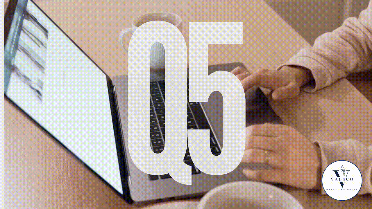 Woman typing on a laptop computer with Q5 overlaying the image